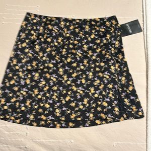Black background floral mini skirt